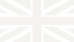 A faint, off-white cross shape appears on a very pale background, with both the cross and the background being almost identical in color—reminiscent of subtle lawn edging blending seamlessly into its surroundings.